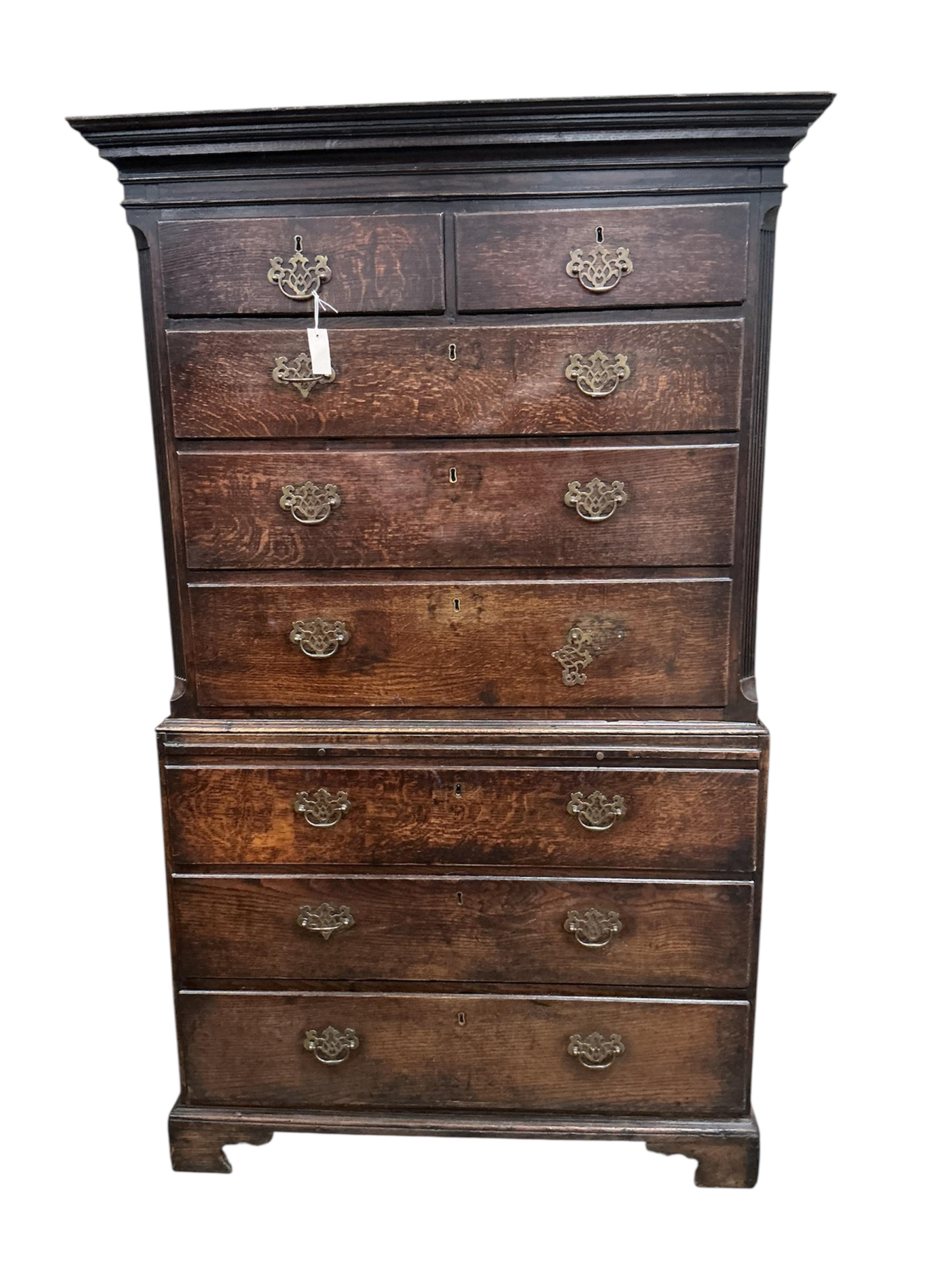 A George III oak chest on chest with slide, width 106cm, depth 52cm, height 186cm